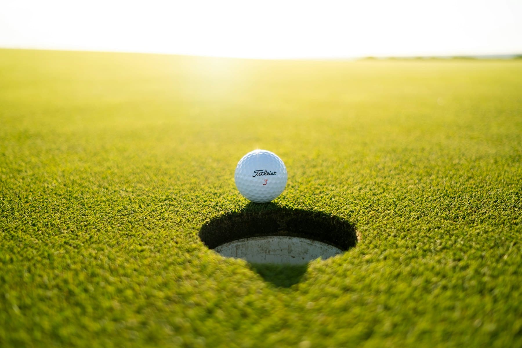 Golf greens under an open sky